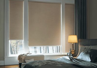 Cozy bedroom with beige roller blinds